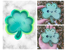 Load image into Gallery viewer, Winky Shamrock Freshie Mold, smiling lucky clover freshie mold, St Patrick&#39;s day freshie mold, irish freshie mold, silicone soap molds
