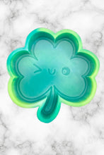 Load image into Gallery viewer, Winky Shamrock Freshie Mold, smiling lucky clover freshie mold, St Patrick&#39;s day freshie mold, irish freshie mold, silicone soap molds
